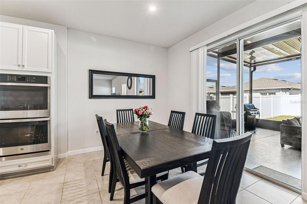 19043 Pebble Wood Ln Spring Hill Spring Hill, FL 34610 - Photo 13 of 35 a view of a dining room with furniture window and outside view