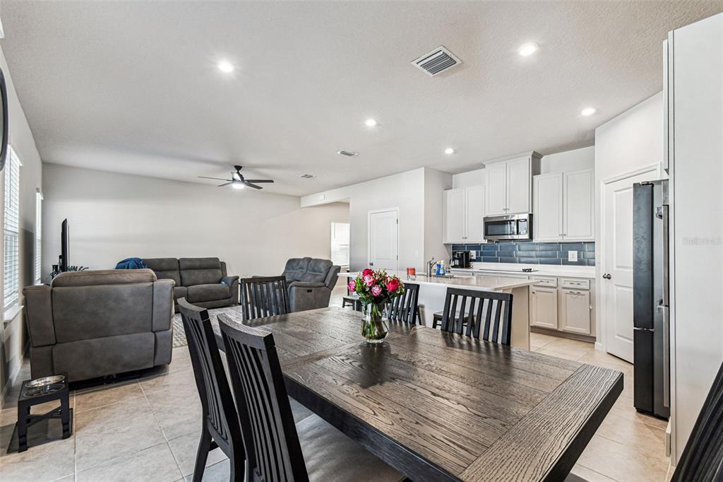 19043 Pebble Wood Ln Spring Hill Spring Hill, FL 34610 - Photo 14 of 35 a view of a dining room with furniture