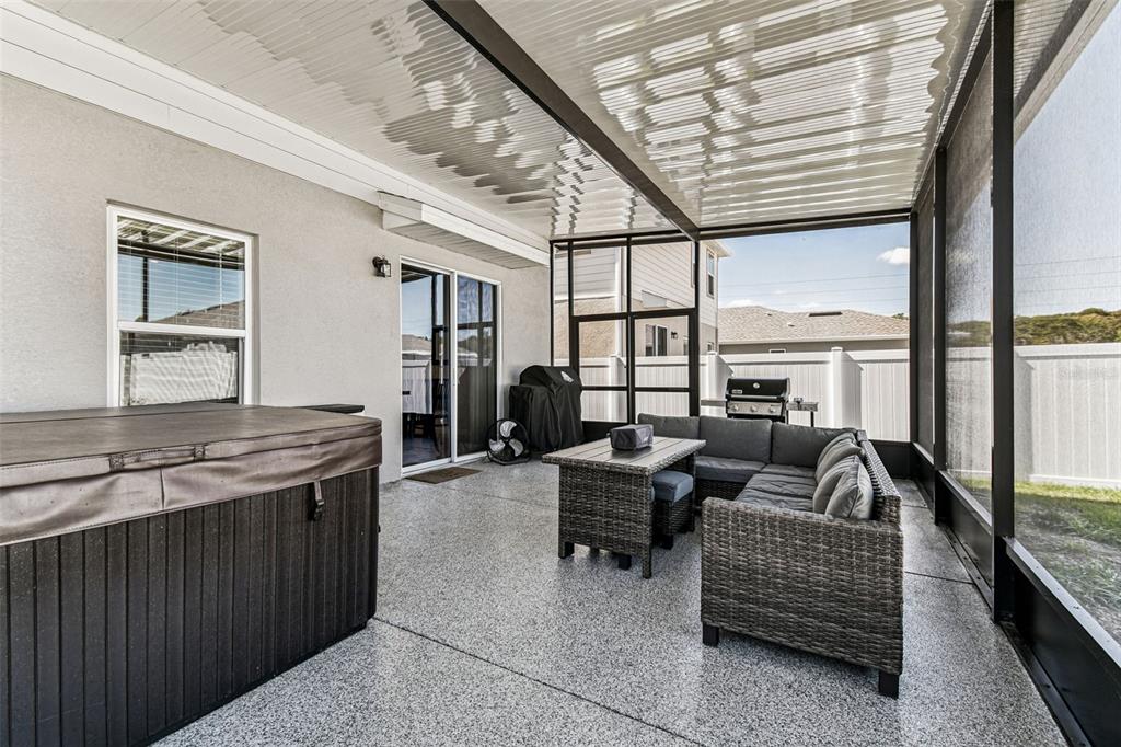 19043 Pebble Wood Ln Spring Hill Spring Hill, FL 34610 - Photo 17 of 35 a living room with furniture and a large window