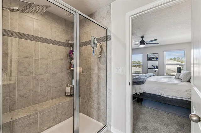 a bedroom with a bed and a mirror