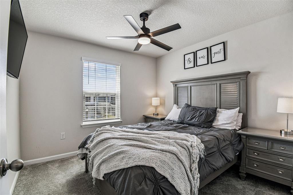 19043 Pebble Wood Ln Spring Hill Spring Hill, FL 34610 - Photo 24 of 35 a bedroom with a bed and window