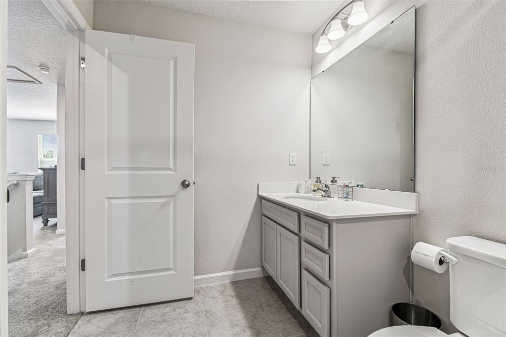 19043 Pebble Wood Ln Spring Hill Spring Hill, FL 34610 - Photo 27 of 35 a bathroom with a sink toilet and shower