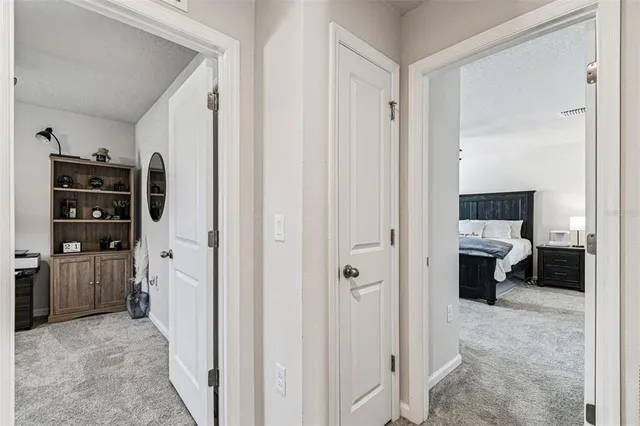 a view of a bedroom with a furniture and closet