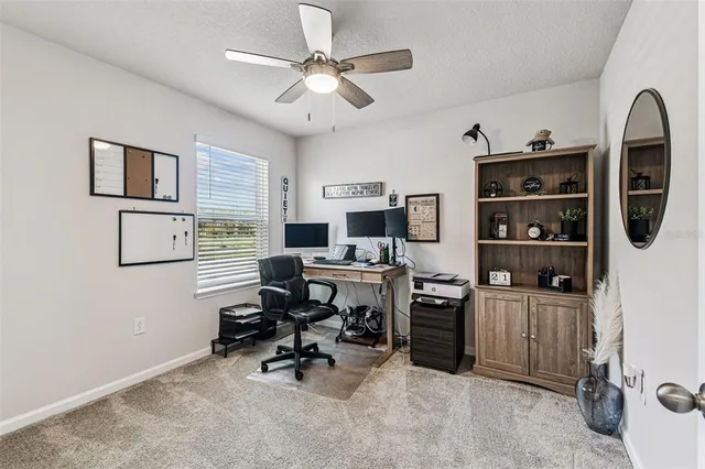 a view of a workspace with furniture