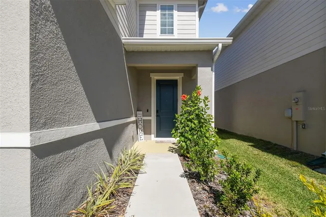 a entryway with flower pots