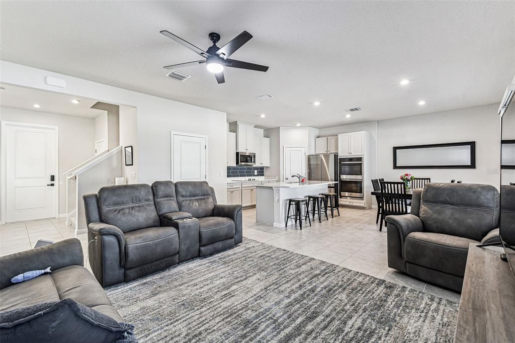19043 Pebble Wood Ln Spring Hill Spring Hill, FL 34610 - Photo 7 of 35 a living room with furniture and a view of kitchen