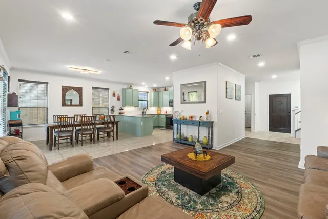 a living room with furniture and a table