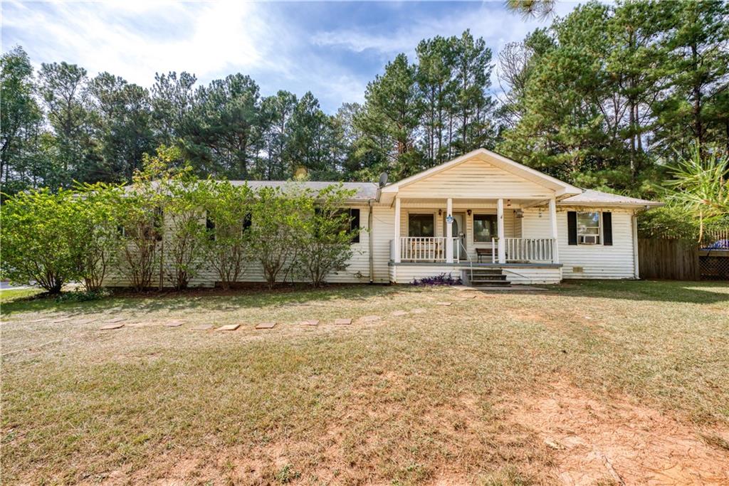 774 Mill Road McDonough, GA 30253 - Photo 1 of 1 a front view of a house with a garden