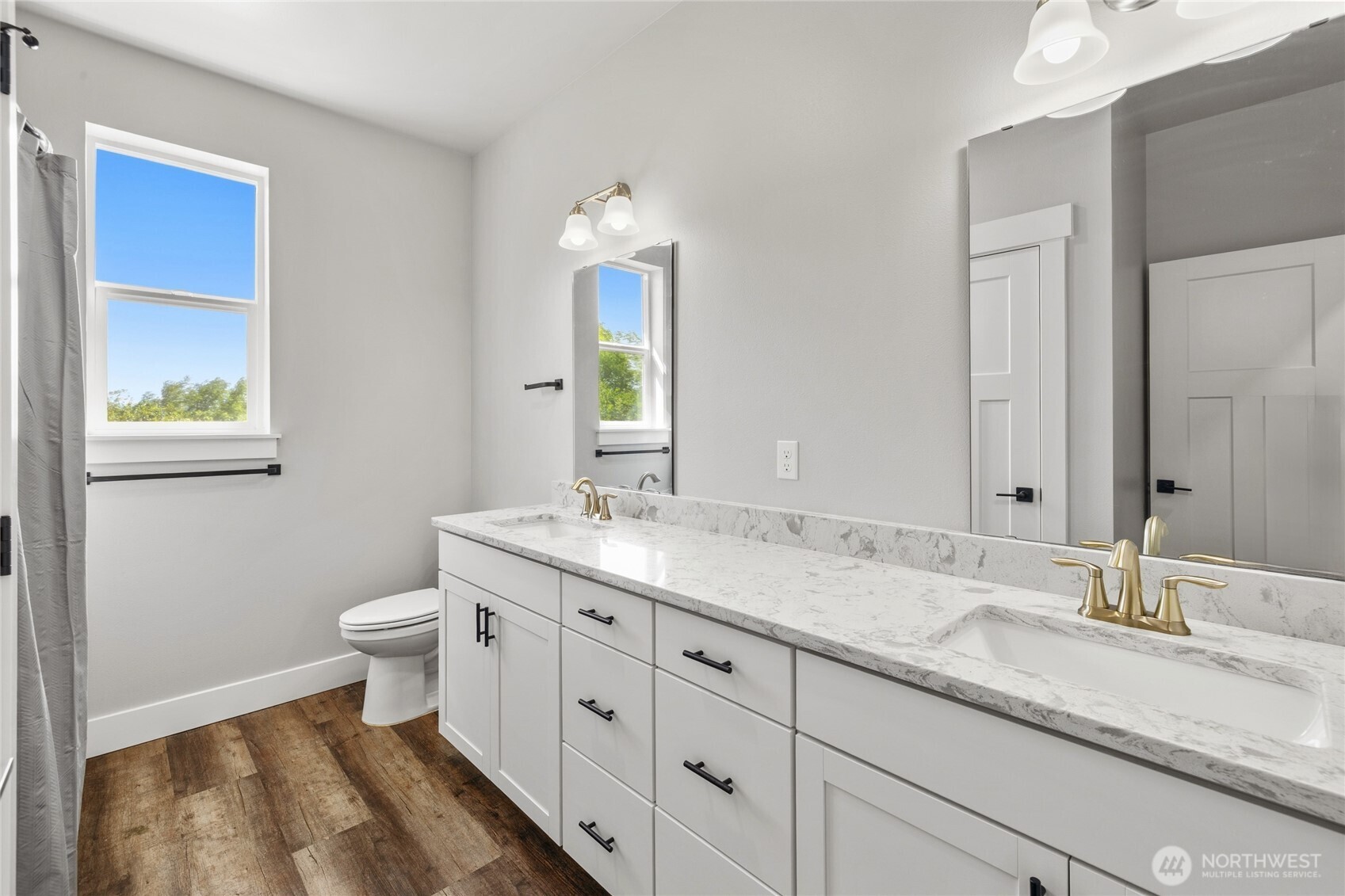 1590 Hunter Road Ellensburg, WA 98926 - Photo 30 of 40 a bathroom with a granite countertop sink toilet and mirror