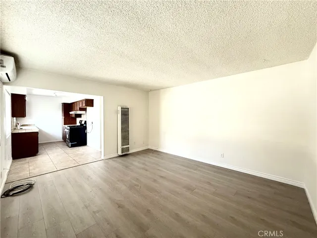 a view of an empty room with a fireplace