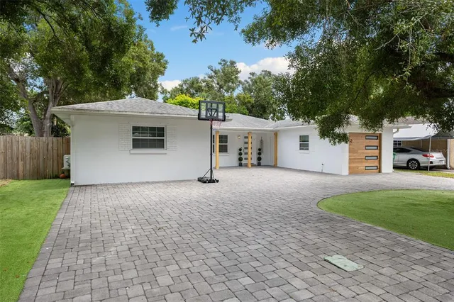 a front view of a house with a yard and a garage