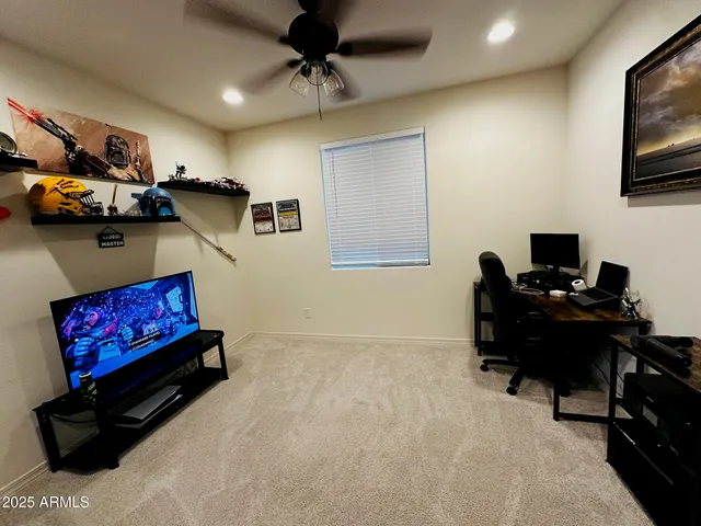a room with furniture and a flat screen tv