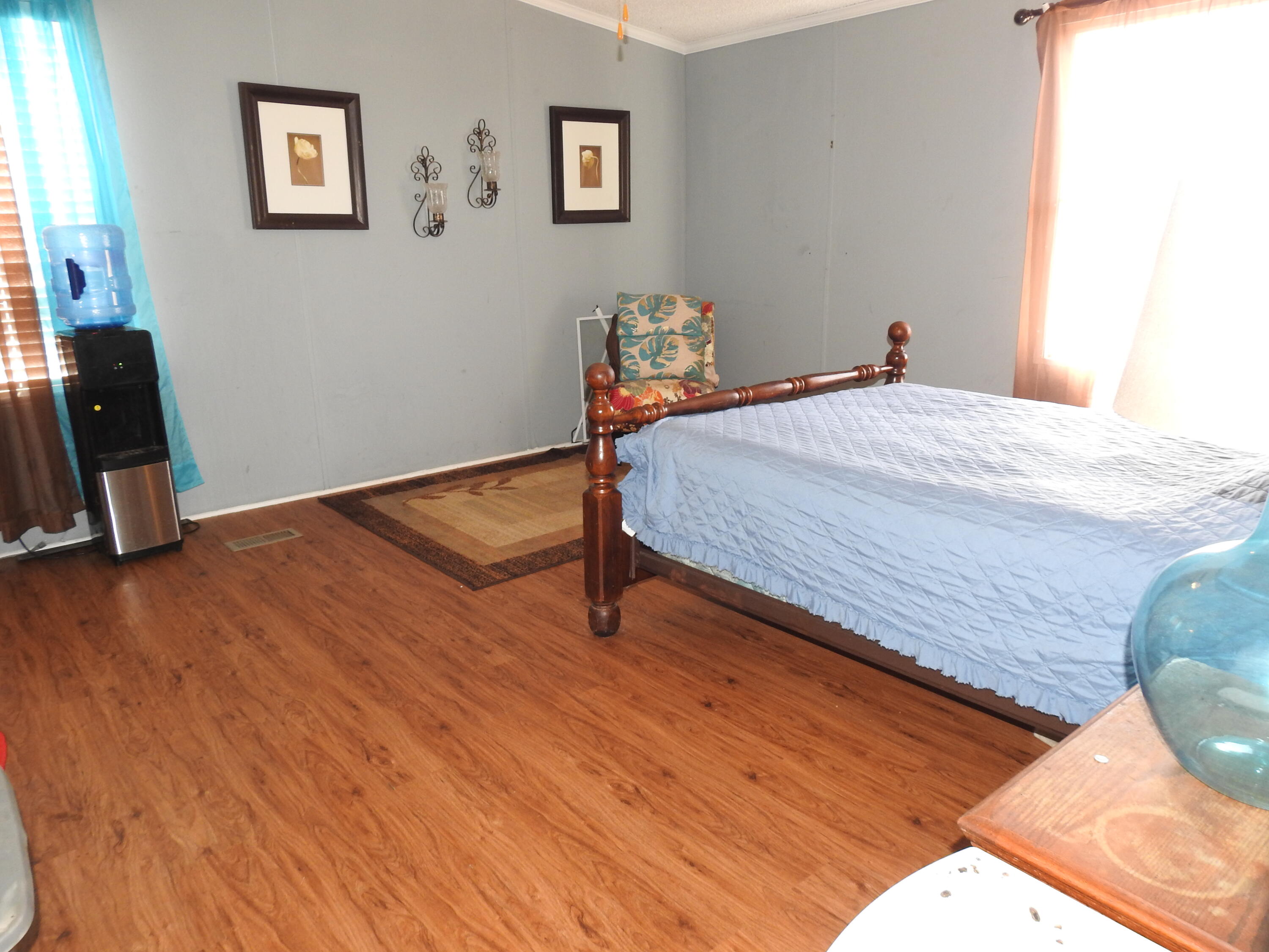 35 Rangeview Road Spur, TX 79370 - Photo 11 of 34 a bed sitting in a bedroom next to a window