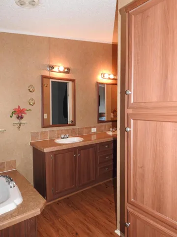 a white toilet sitting next to a bathroom sink