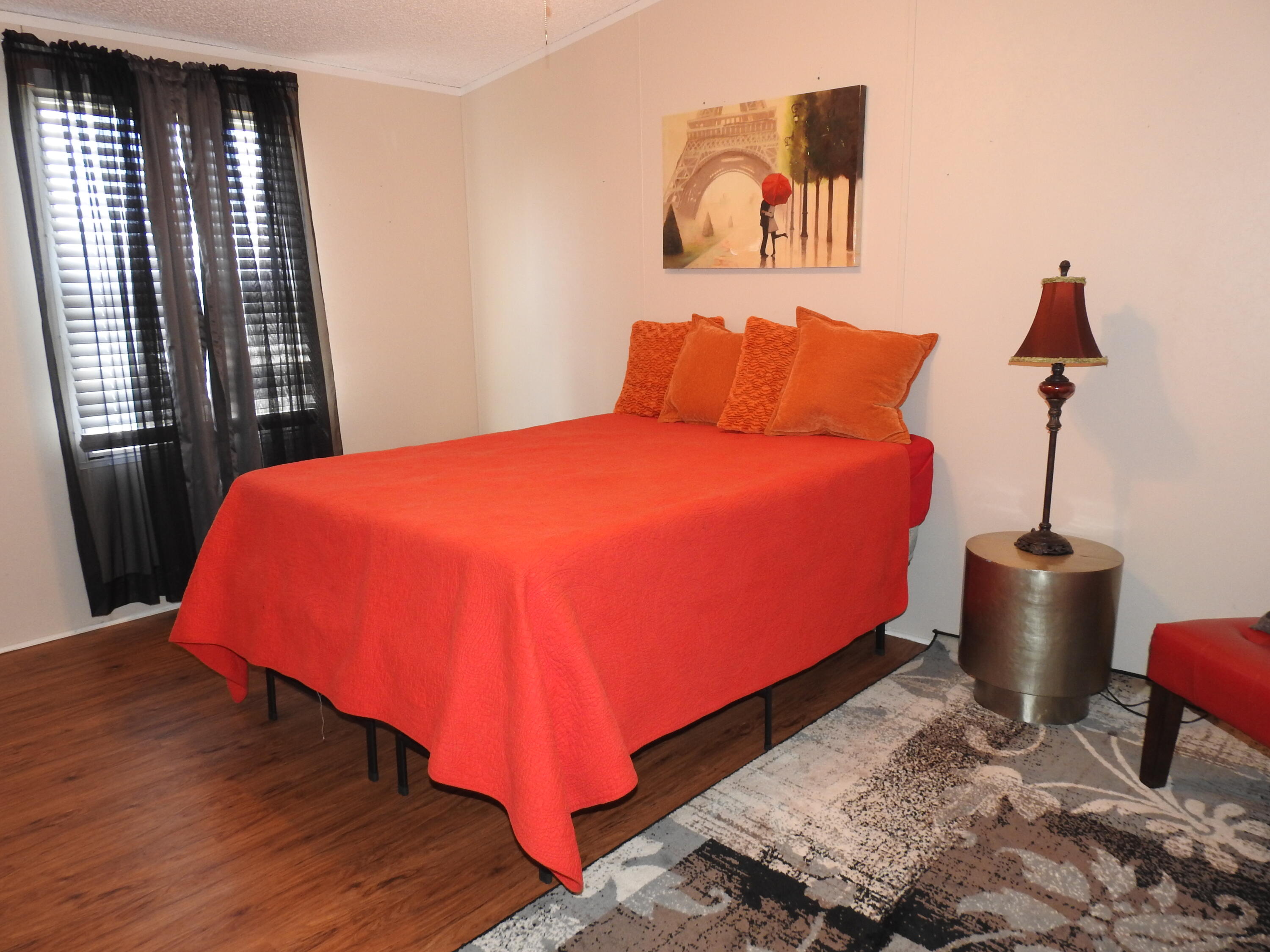 35 Rangeview Road Spur, TX 79370 - Photo 18 of 34 a blue bed sitting in a bedroom next to a window
