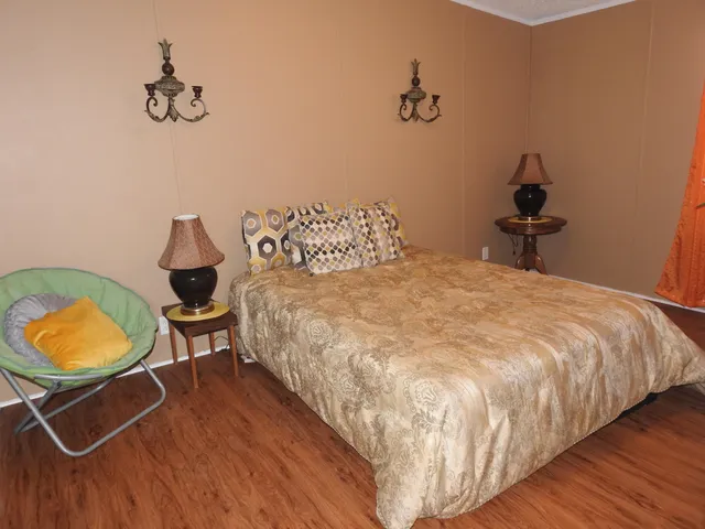 a bathroom with a toilet and a shower curtain