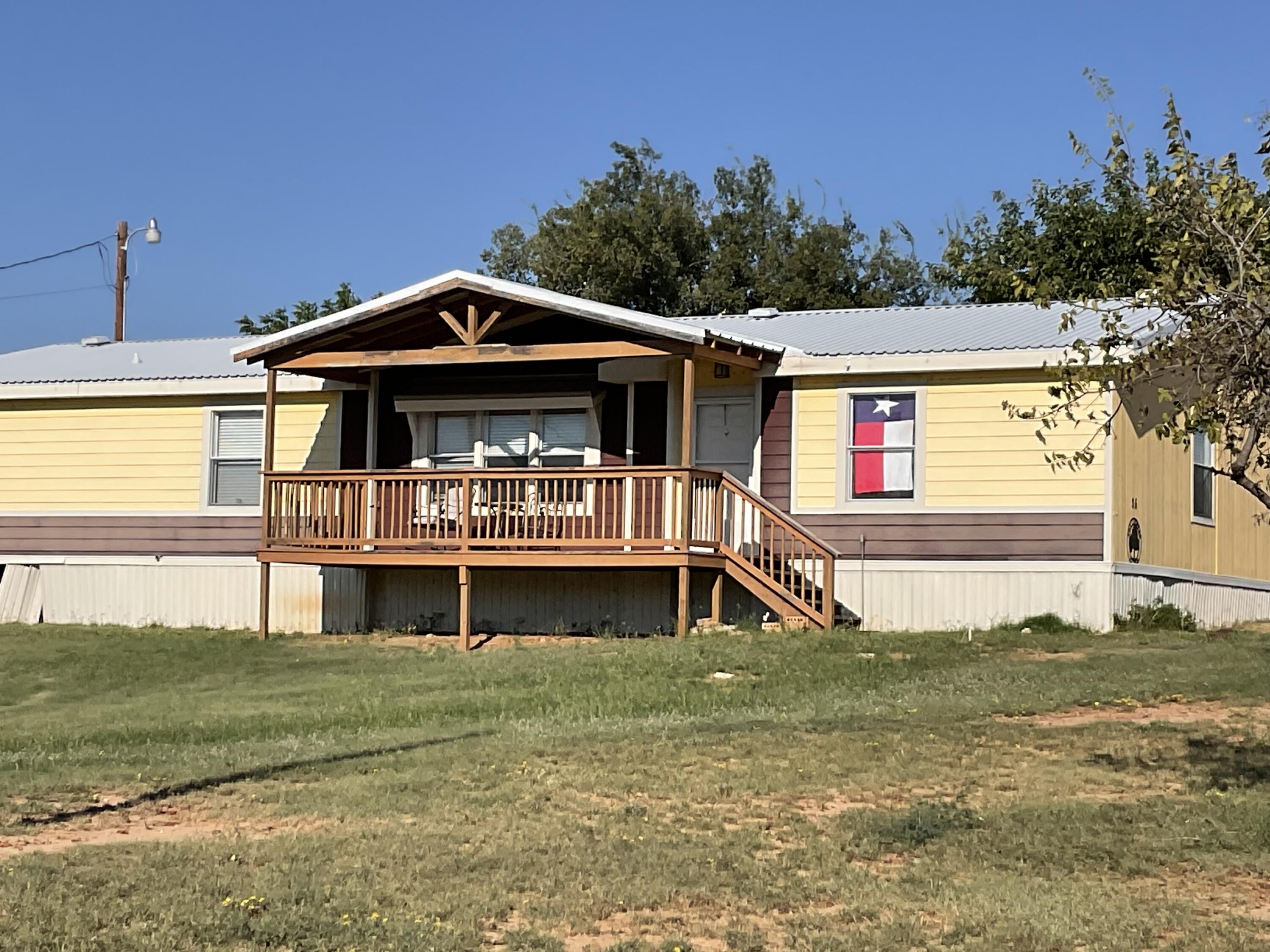 35 Rangeview Road Spur, TX 79370 - Photo 28 of 34 a front view of a house with a yard