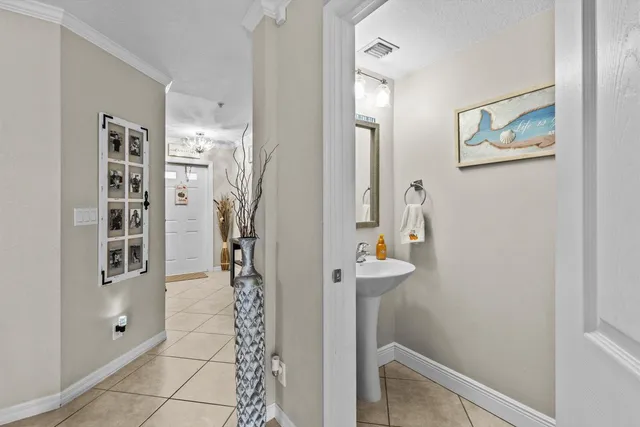 walk in closet with view of bathroom