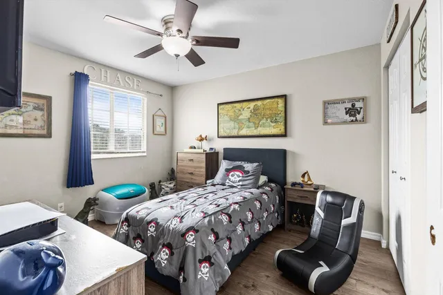 a bedroom with two beds and a table