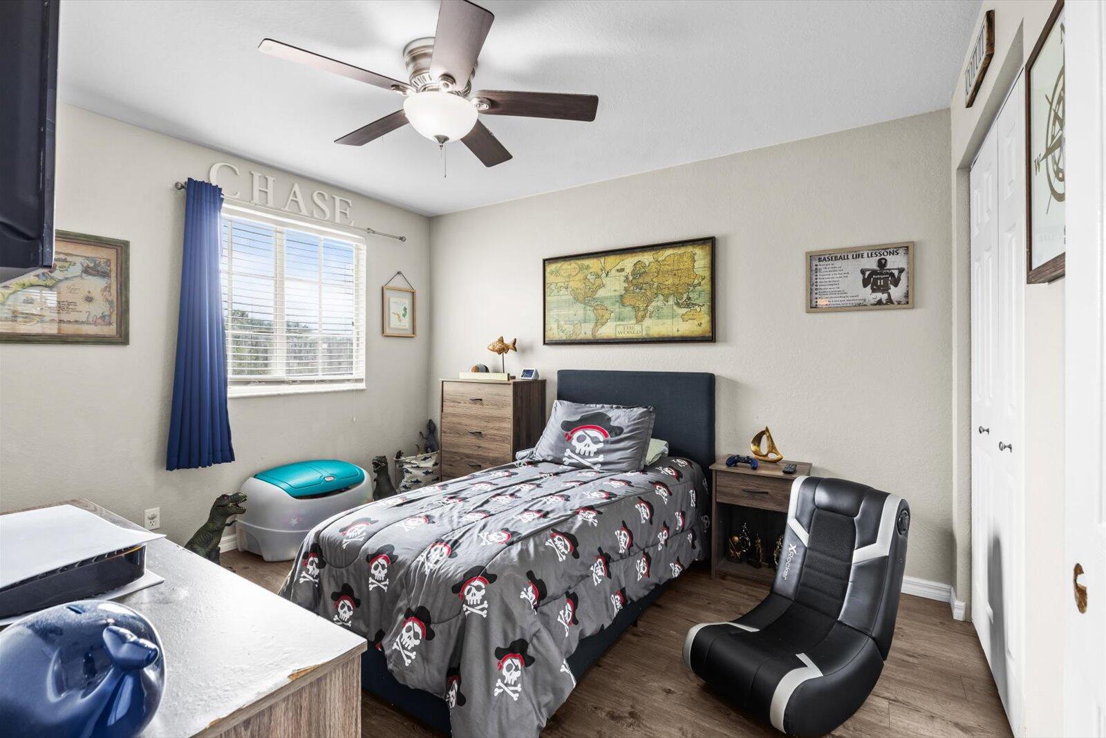 5290 Southeast Mitchell Lane Stuart, FL 34997 - Photo 20 of 44 a bedroom with two beds and a table