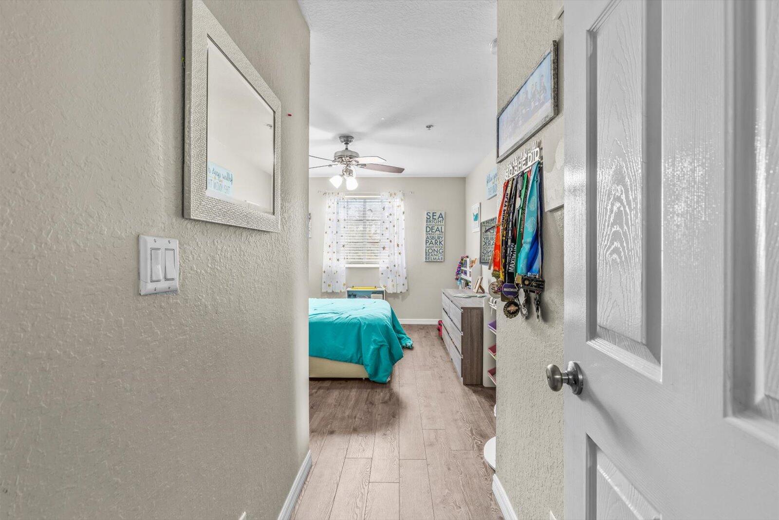 5290 Southeast Mitchell Lane Stuart, FL 34997 - Photo 24 of 44 a view of a entryway with furniture and floor to ceiling window