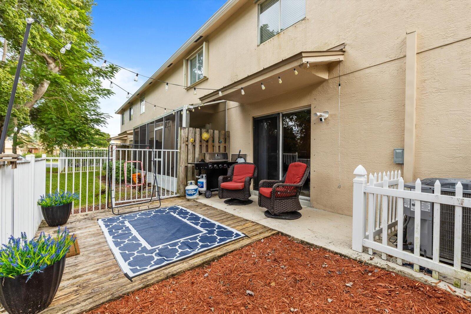5290 Southeast Mitchell Lane Stuart, FL 34997 - Photo 27 of 44 a view of a chair and tables in the balcony