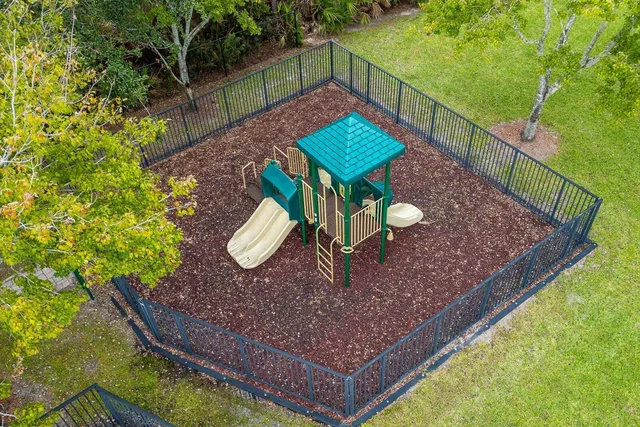 a view of a garden with a building