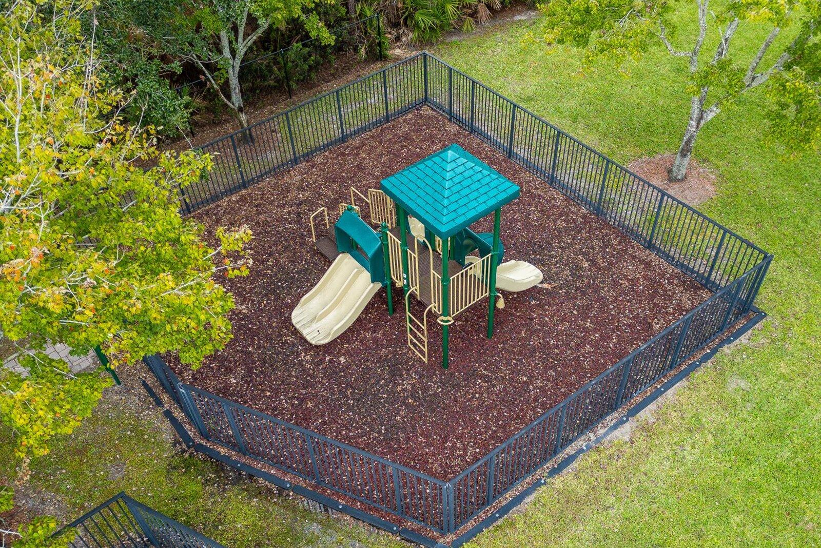 5290 Southeast Mitchell Lane Stuart, FL 34997 - Photo 36 of 44 a view of a backyard with sitting area