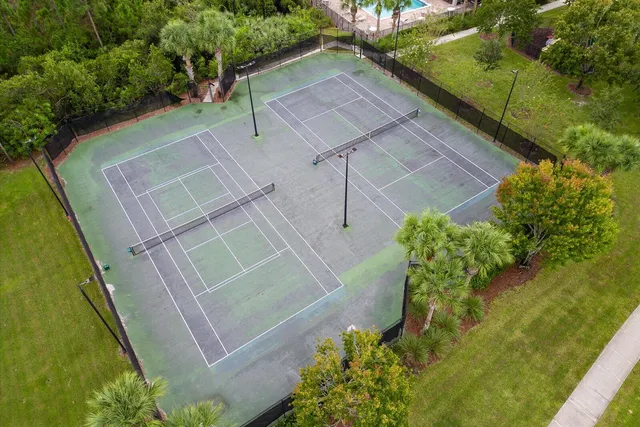 a view of a deck with a table chairs and a fire pit