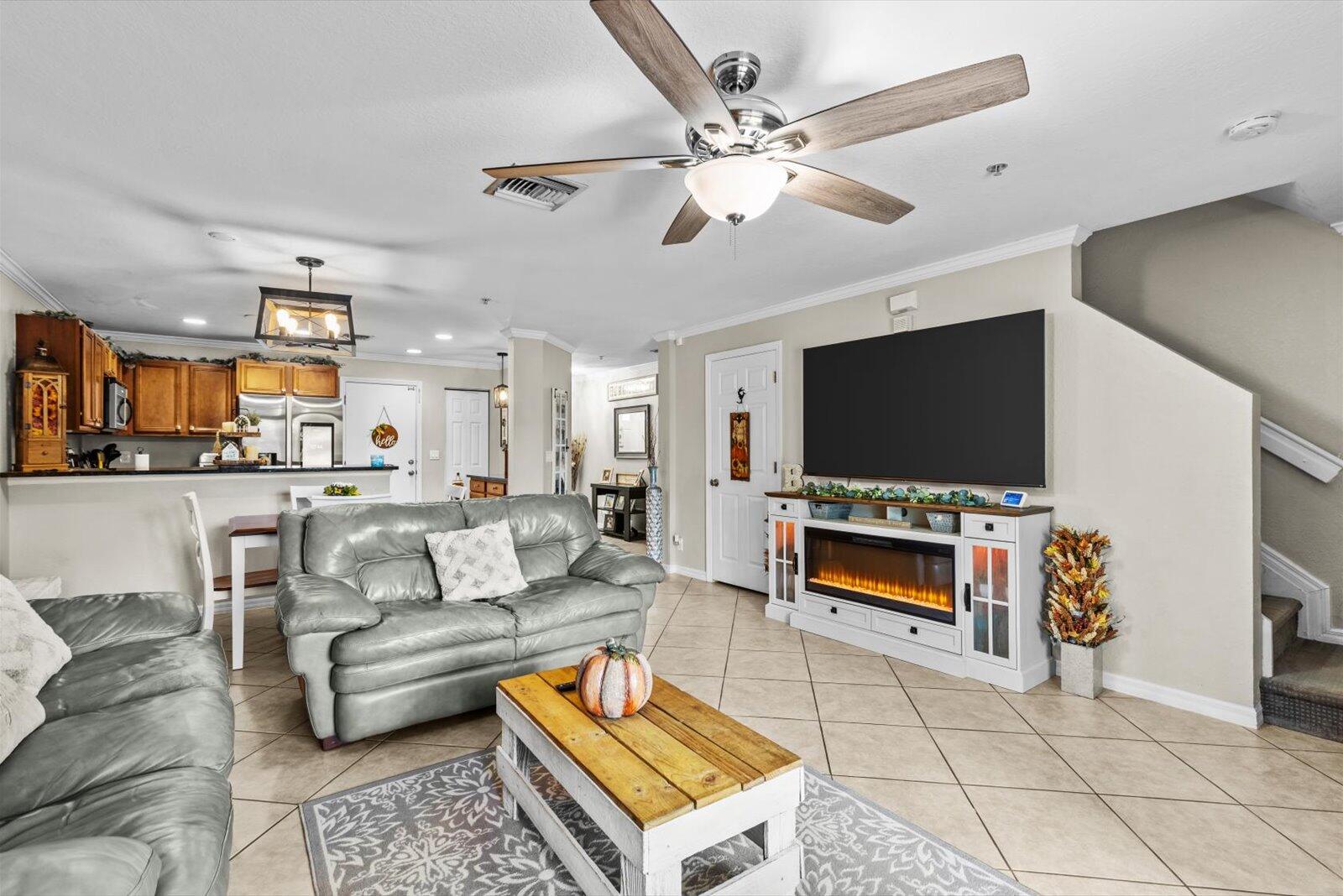 5290 Southeast Mitchell Lane Stuart, FL 34997 - Photo 7 of 44 a living room with furniture and a flat screen tv