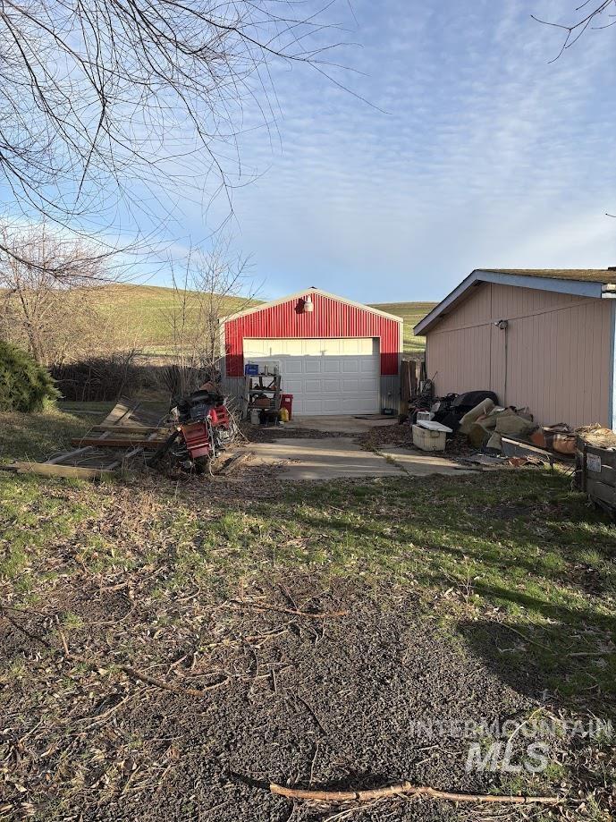 111 Throop Street Colfax, WA 99111 - Photo 9 of 10 View of yard with an outbuilding and a garage
