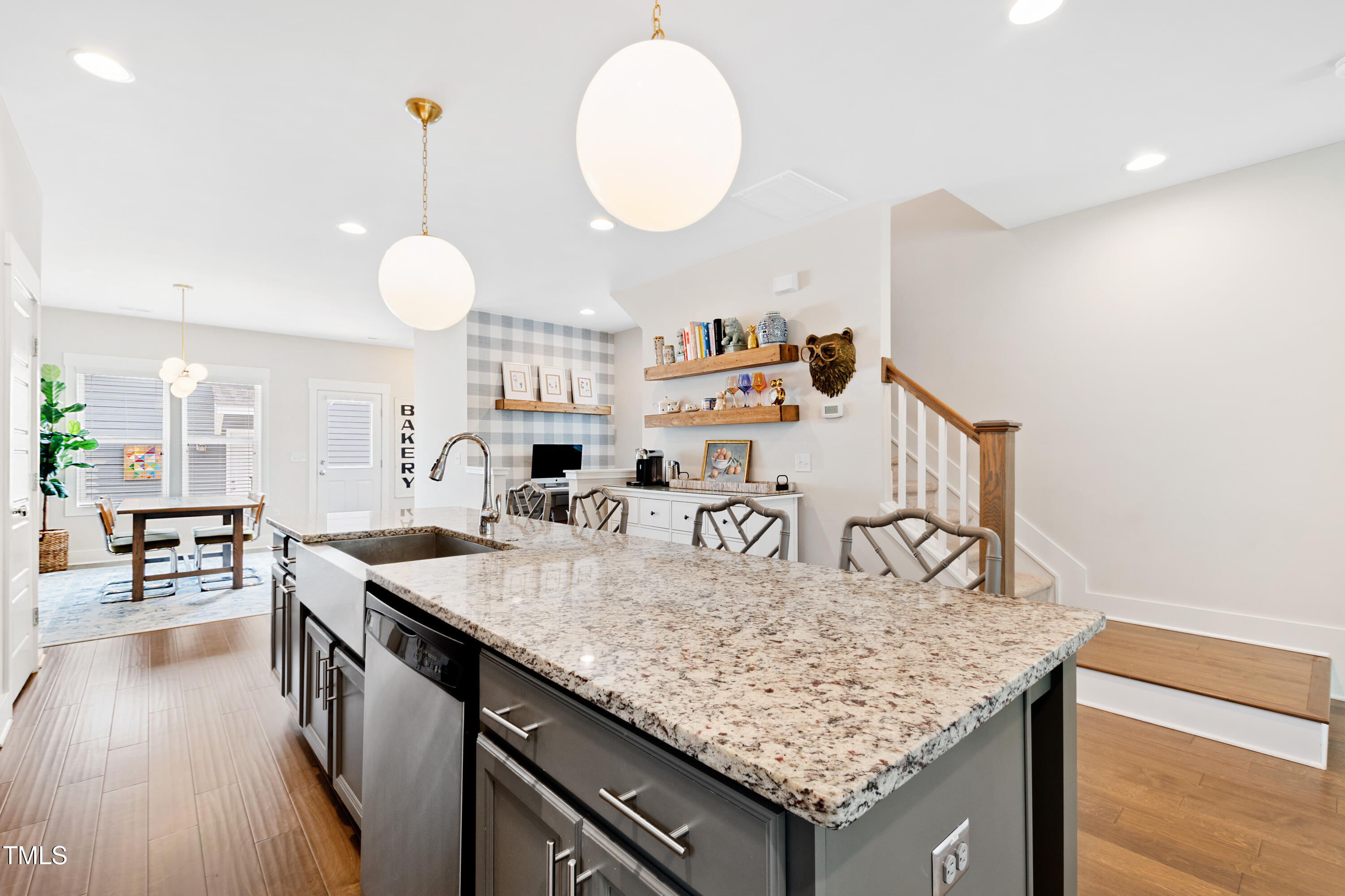 71 Hawk Point Road Chapel Hill, NC 27516 - Photo 13 of 35 a kitchen with granite countertop a table and chairs in it