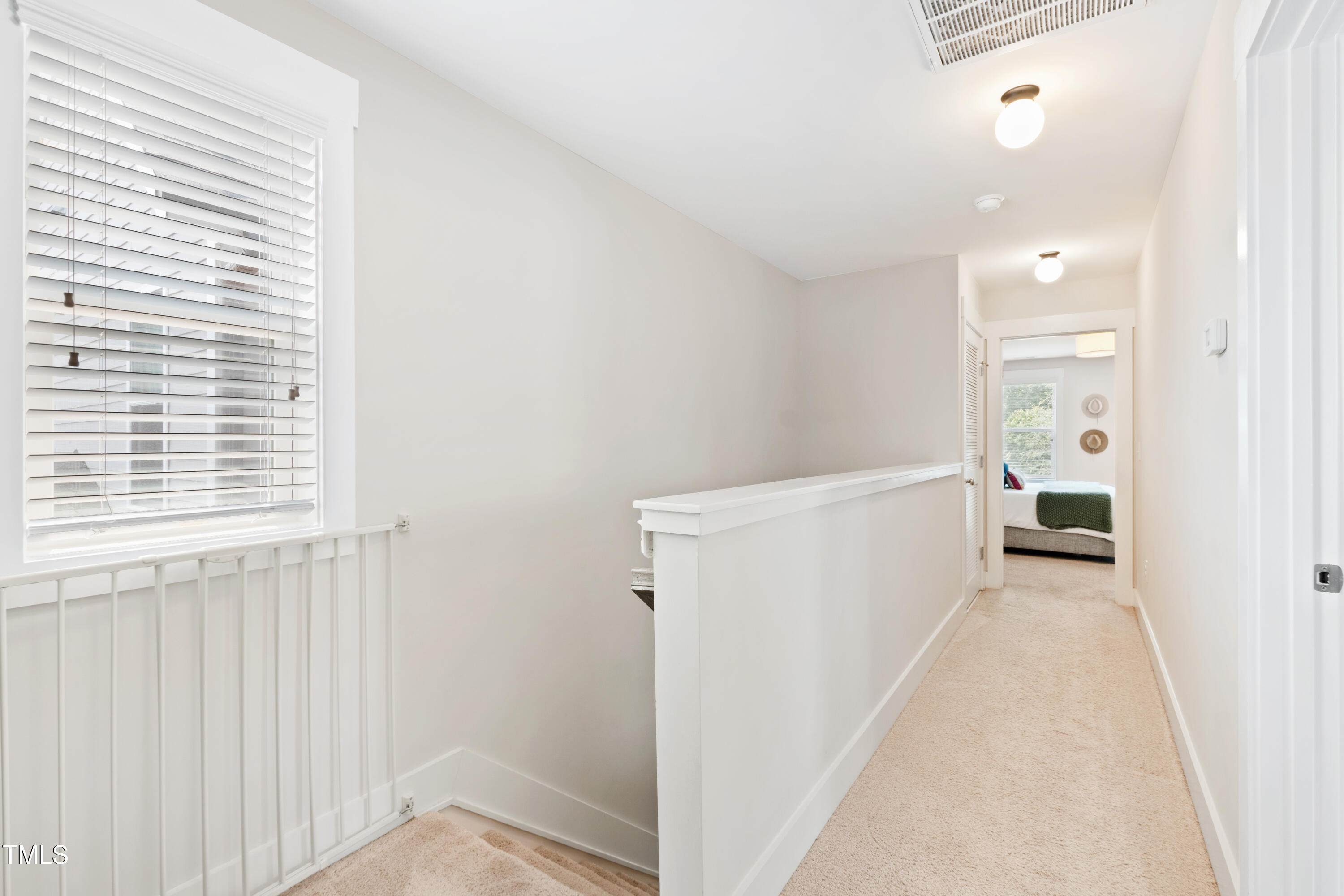 71 Hawk Point Road Chapel Hill, NC 27516 - Photo 15 of 35 a view of a hallway with a white walls