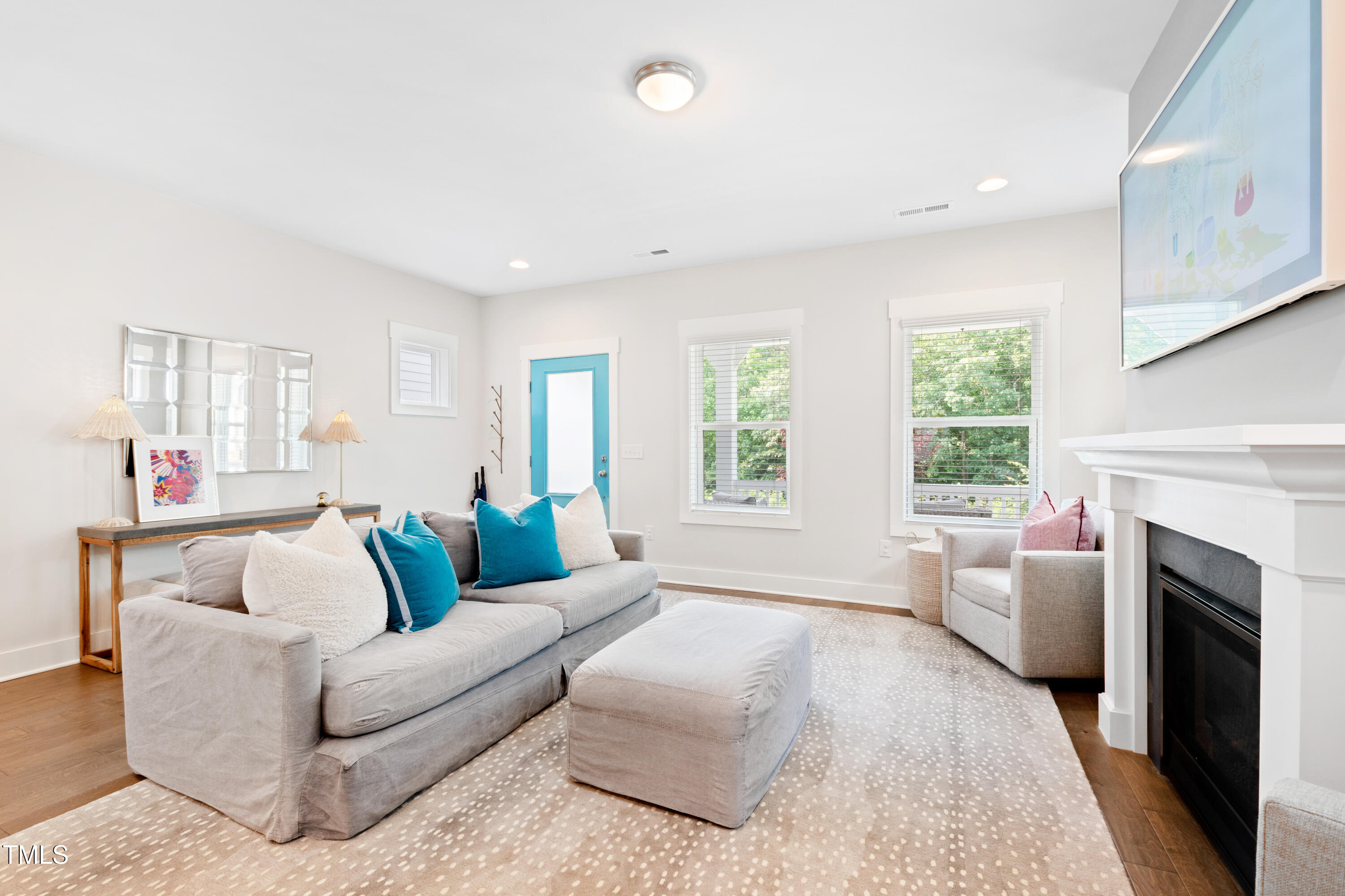 71 Hawk Point Road Chapel Hill, NC 27516 - Photo 19 of 35 a living room with furniture a fireplace and a large window