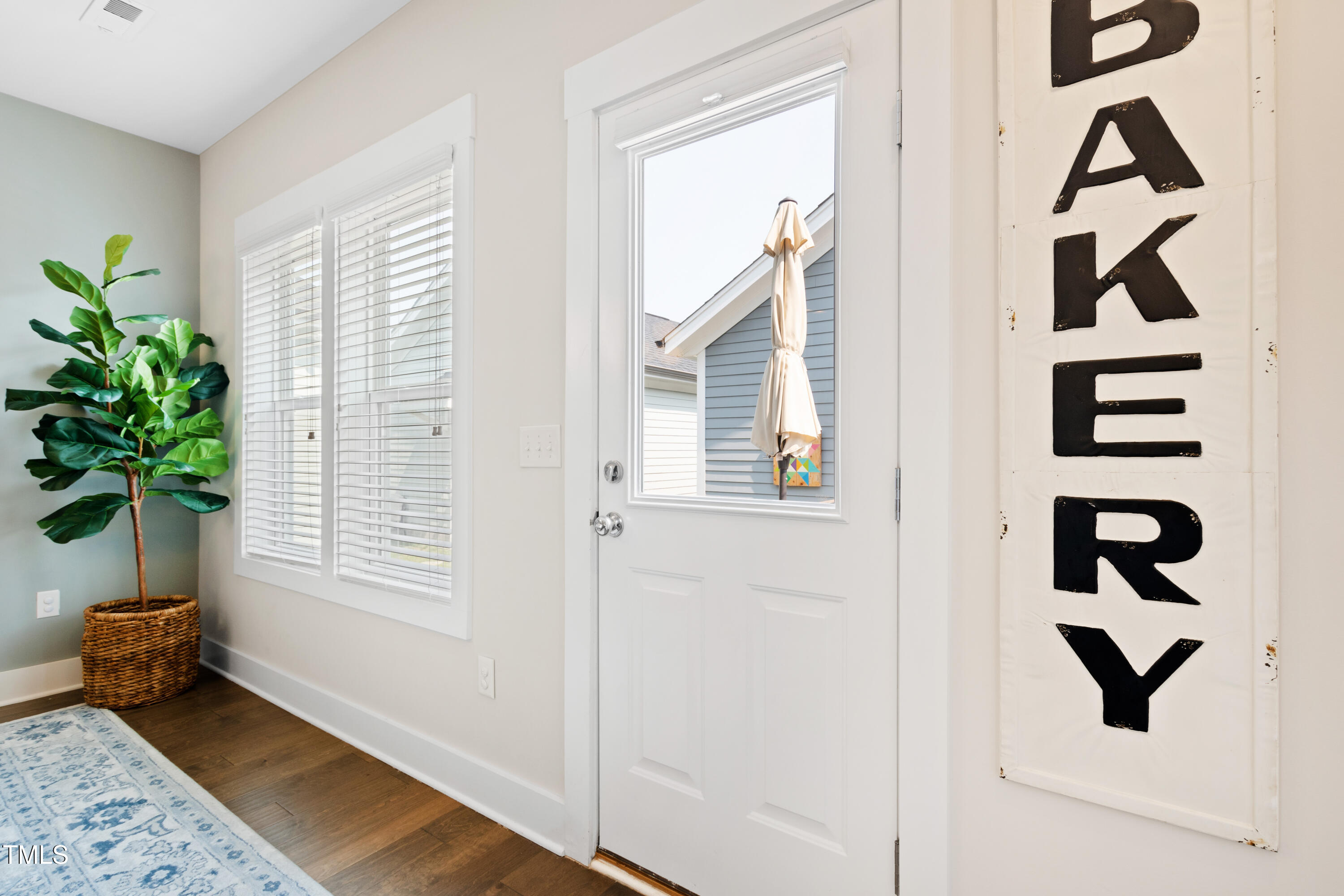 71 Hawk Point Road Chapel Hill, NC 27516 - Photo 7 of 35 a view of a closet with wooden floor and a potted plant