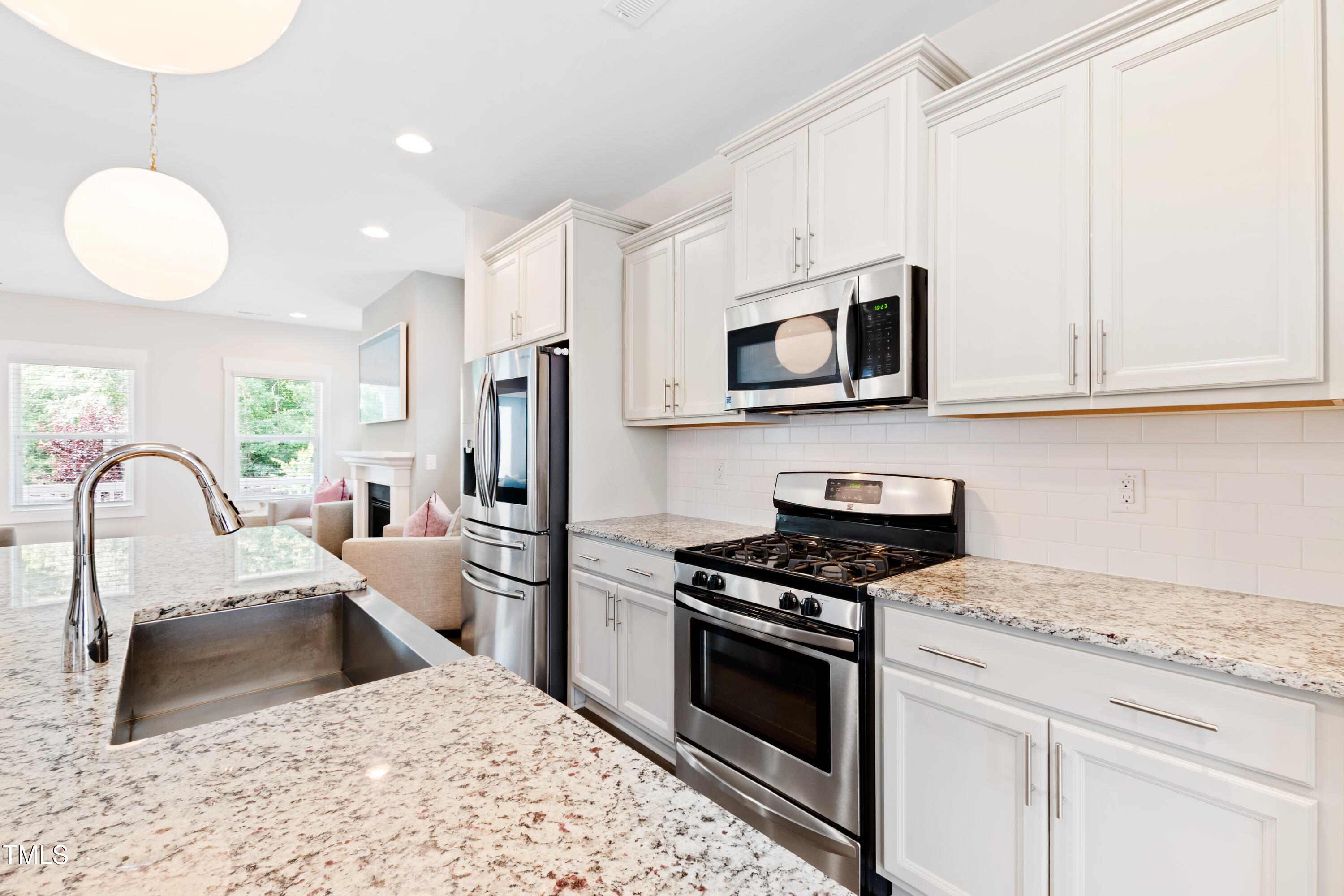 71 Hawk Point Road Chapel Hill, NC 27516 - Photo 10 of 35 a kitchen with stainless steel appliances granite countertop a stove a sink dishwasher a microwave oven with granite countertops and cabinets