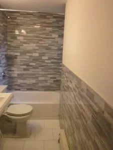 a bathroom with a toilet and a shower