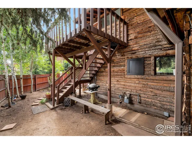 a view of balcony with wooden floor and fence