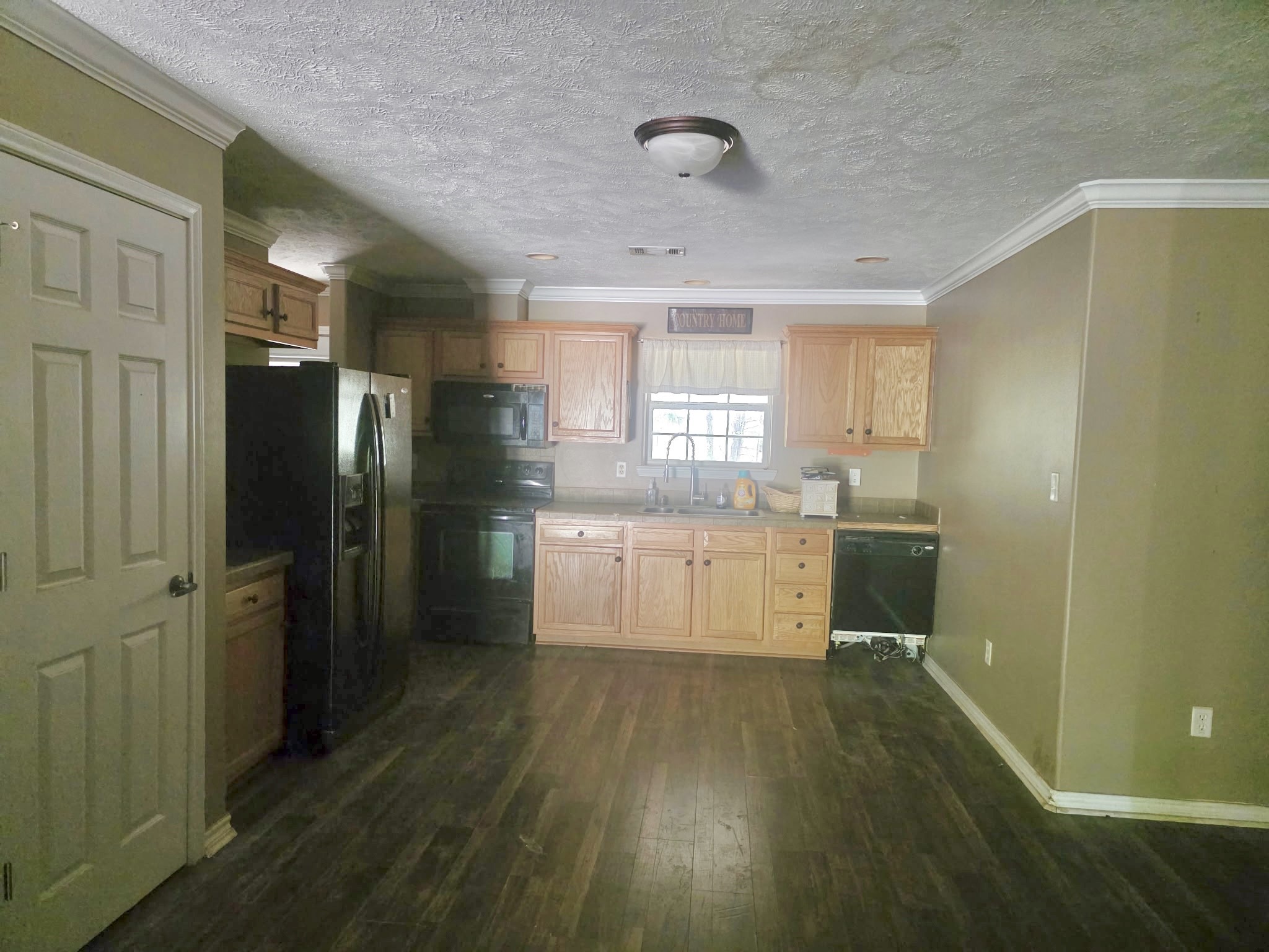 633 Ira Denson Road Coldspring, TX 77331 - Photo 26 of 27 a large kitchen with a sink stainless steel appliances and window