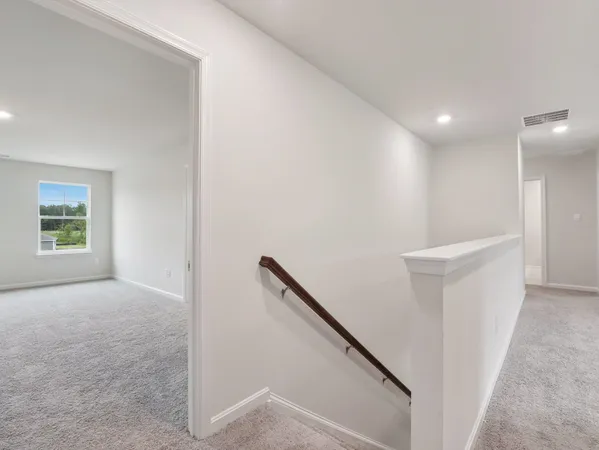 a view of hallway with stairs