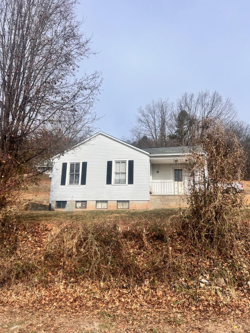 1618 Read Mountain Road Northeast Roanoke, VA 24019 - Photo 1 of 11 a house with trees in the background