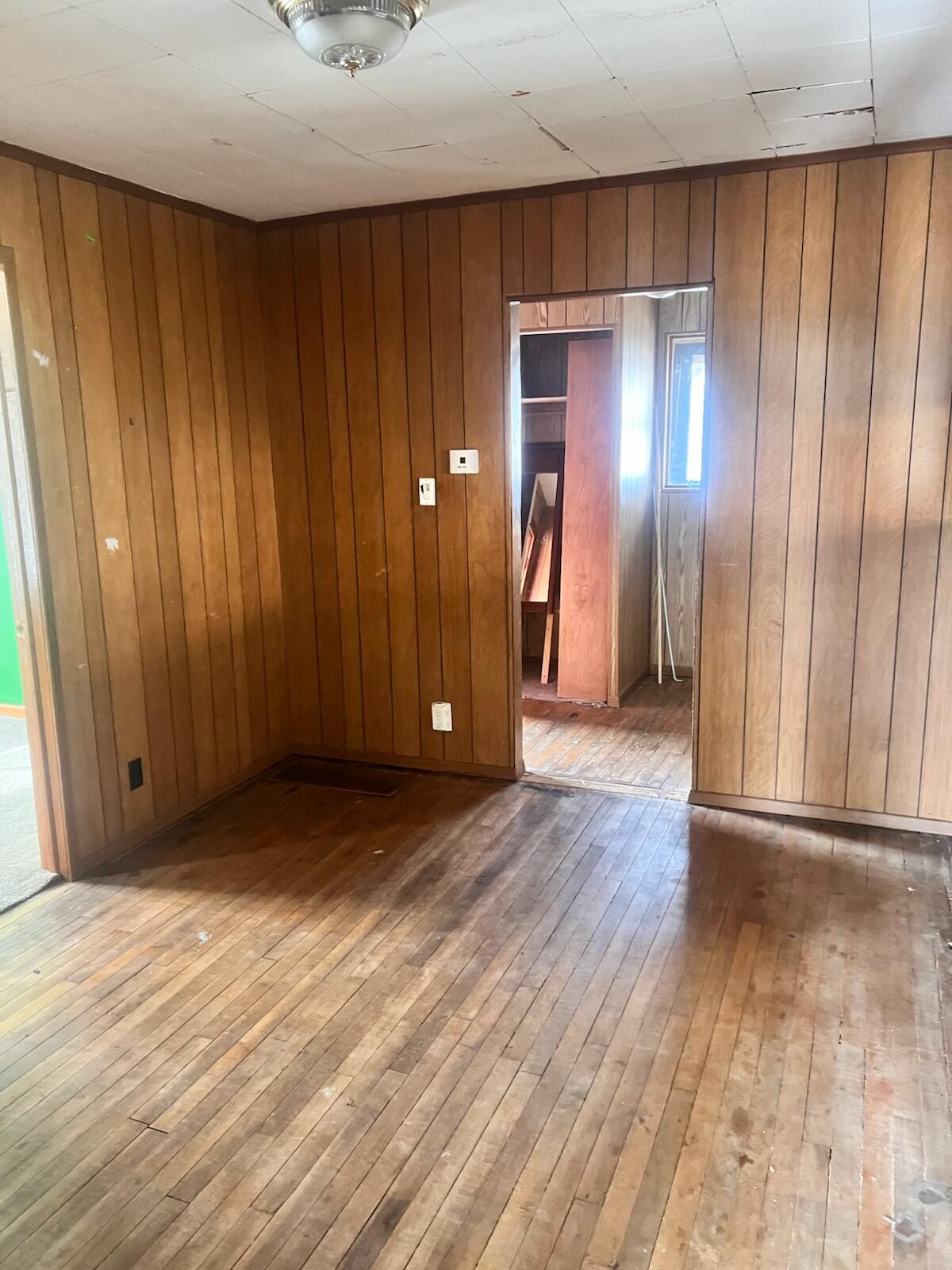 1618 Read Mountain Road Northeast Roanoke, VA 24019 - Photo 5 of 11 an empty room with wooden floor and windows