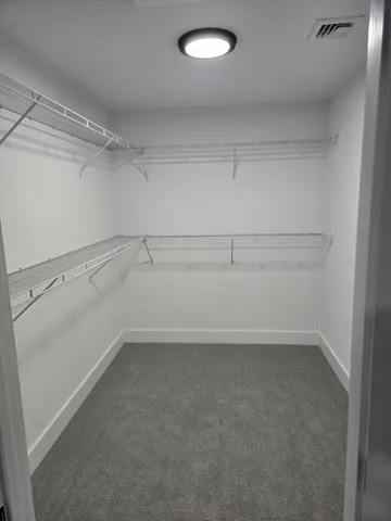 a view of an empty walk in closet