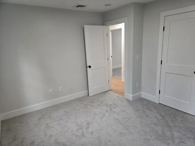 an empty room with closet area