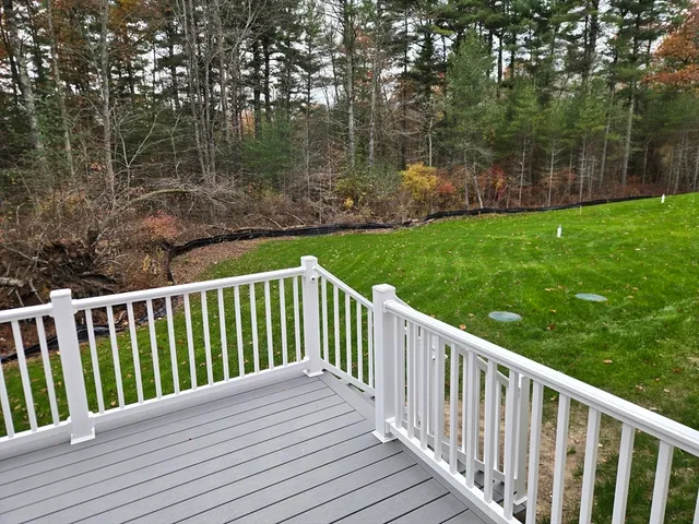a balcony with trees in front of it