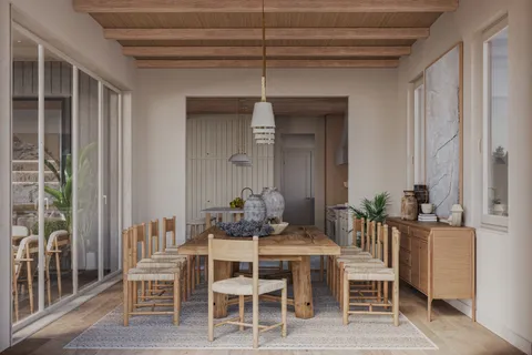 a dining room with furniture and window