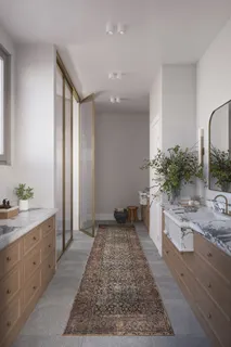 a spacious bathroom with a granite countertop sink and a mirror