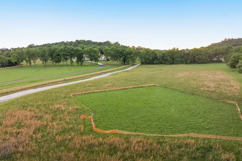 a view of a field with a big yard