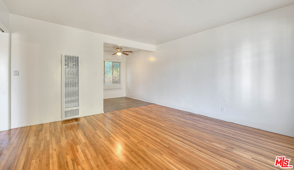7017 Ramsgate Place Los Angeles, CA 90045 - Photo 12 of 32 a view of empty room with wooden floor