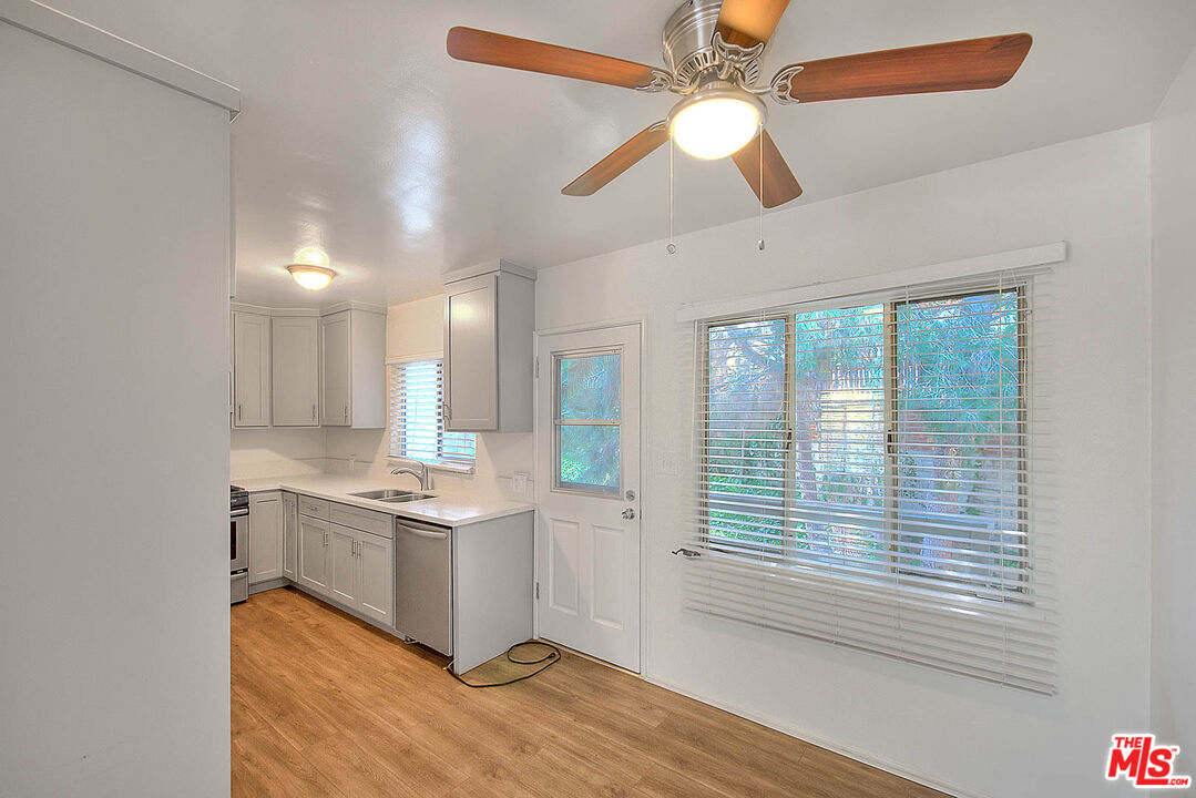 7017 Ramsgate Place Los Angeles, CA 90045 - Photo 19 of 32 a room with stainless steel appliances granite countertop a stove and a window
